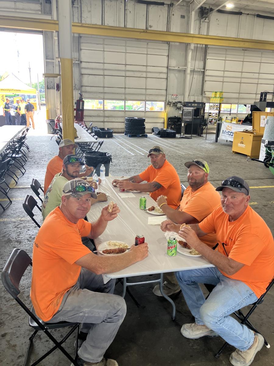 The hard-working crew of Fronabarger Concreters enjoy lunch.
(McCoy Construction and Forestry photo)