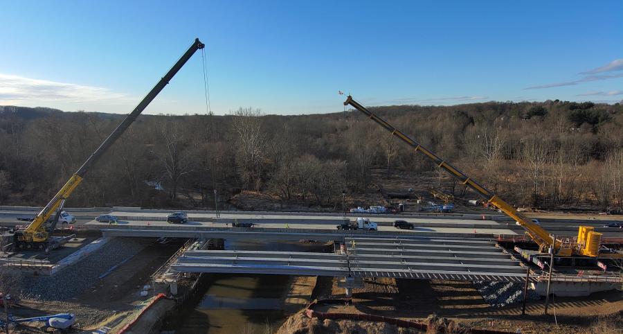 Crews set bulb-tee bridge girders over Difficult Run for the new westbound Route 7 bridge.
(Shirley Contracting photo)