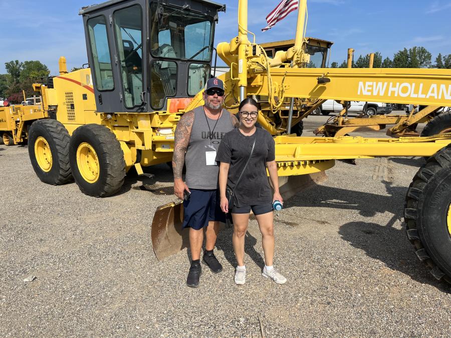 Robert and Lissette Finchum of Finchum Construction in Spartanburg, S.C., check out a New Holland grader, as well as Bobcat loaders.
(CEG photo)