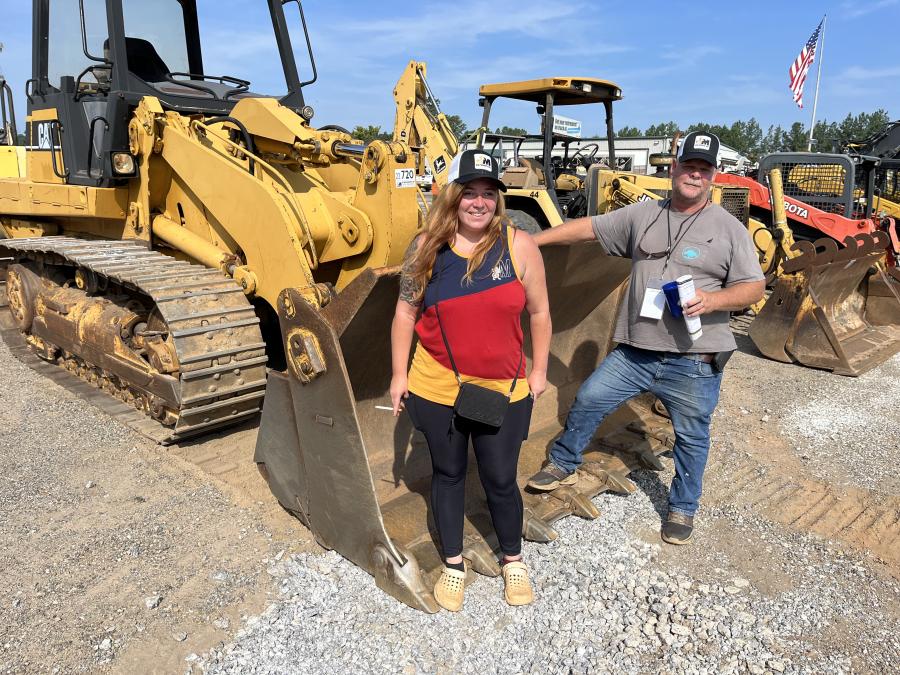 Destiny Bradford and Ricky Todd, both of DRT Construction in Greenville, S.C., look over this Cat 953C loader and other wheel loaders.
(CEG photo)