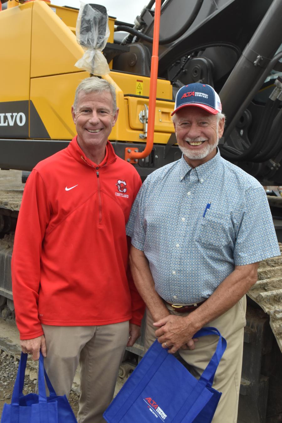 Tim Delaney (L) and Harry Wells do some serious shopping to see if there is anything that should be added to American Equipment’s rental fleet.
(CEG photo)