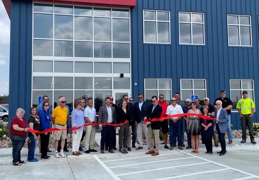 Mike Sill II cuts the ribbon on Road Machinery & Supplies’ new facility in Byron, Minn.
(RMS photo)