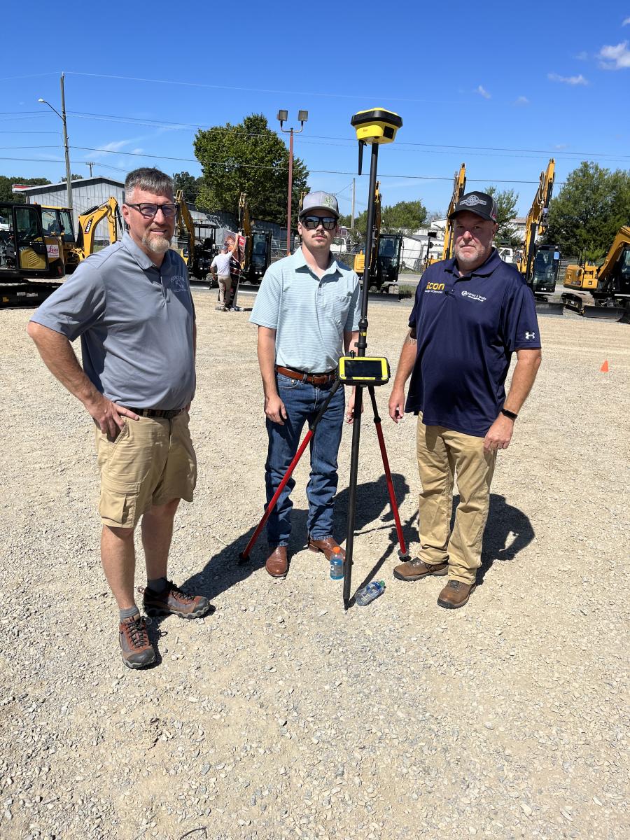 (L-R): Taylor Fowler of Fowler Excavating, Brevard, N.C., speaks with Braxton Fore and Charles Clausen, both of Transit & Level Clinic, about the Leica ICON Geosystem, which allows the operator to dig to 100th of-an-inch on grade.
(CEG photo)