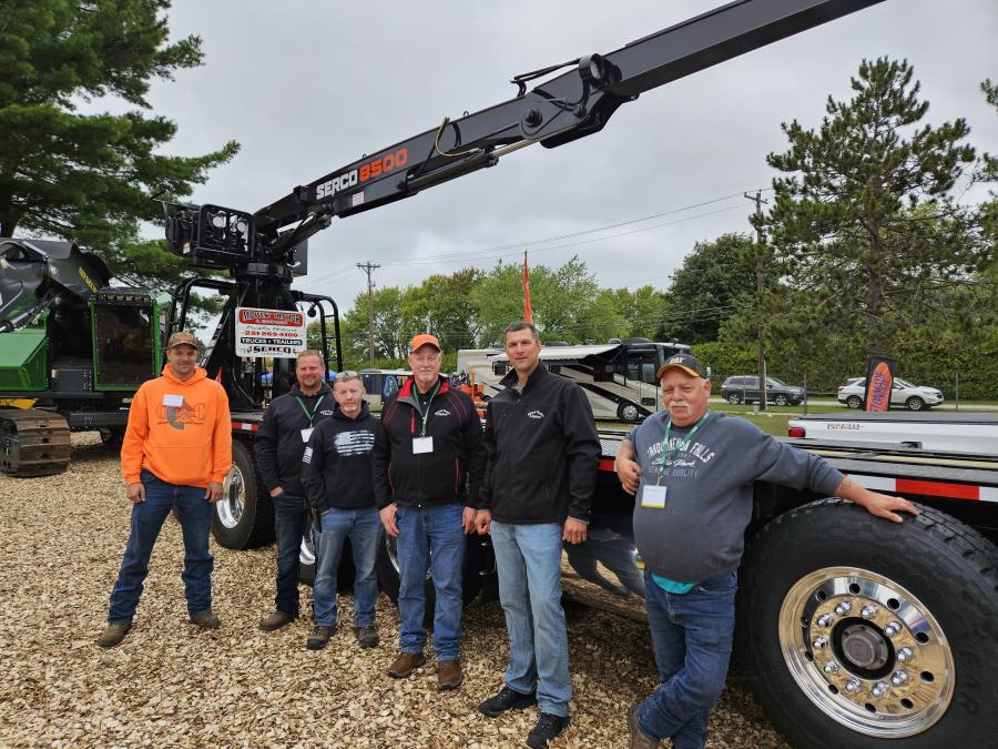 Midwest Tractor & Equipment of Buckley, Mich., brought this Serco 8500 on a 6-axle log truck. (L-R) are Matt Schaudt, Jeff Cade, Shawn Muma, Larry Cade, Chad Bisballe and Rod Porter, all of Midwest Tractor & Equipment. 
(CEG photo)