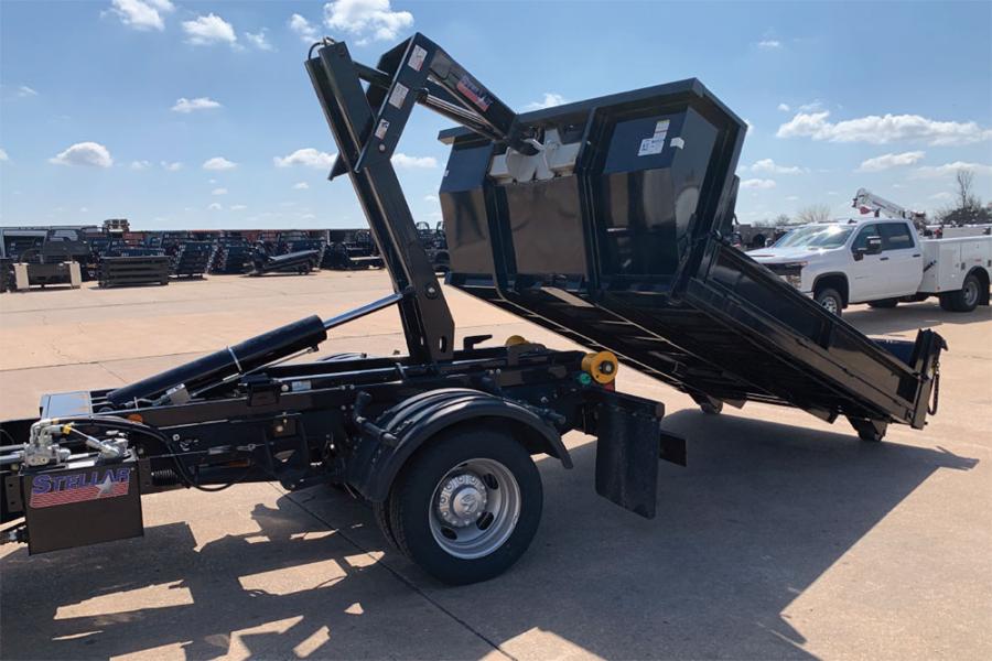 When working with a hooklift, an operator can eliminate extra steps needed to hook to a container. The user can simply deploy the hook, back up to the container, hook the container and pull it onto the truck all from the truck cab.