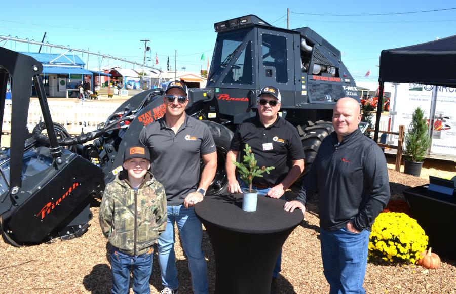 (L-R):  Zander McKenzie, Ryan McKenzie and Bobby Crisp of Quality Equipment and Parts, Lake City, Fla., and John DalBianco of Prinoth had the all-new Prinoth T-Rex 300mt at the center of their display. (CEG photo)