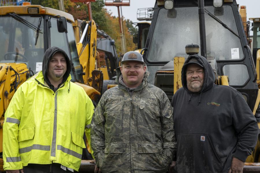 (L-R): Jesse Veprauskas and Ken Liberty, both of Jesse Property Services in Southwick Mass., and Eddie Benton of Greensite Tree and Land of Feeding Hills, Mass., stand in front of a 1994 Caterpillar 426B backhoe.
(CEG photo)
