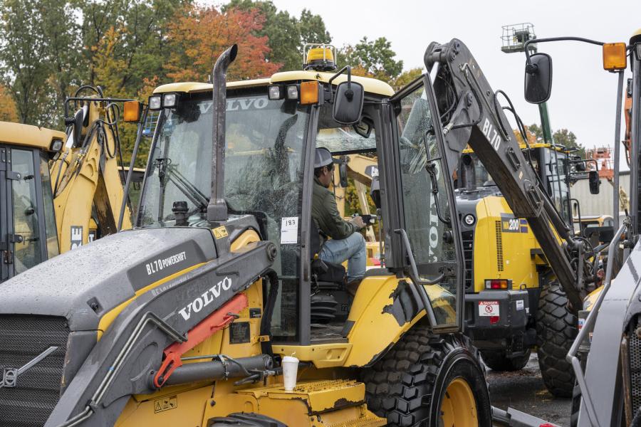 An attendee tests drives a 2010 Volvo BL70 backhoe with power shift.
(CEG photo)
