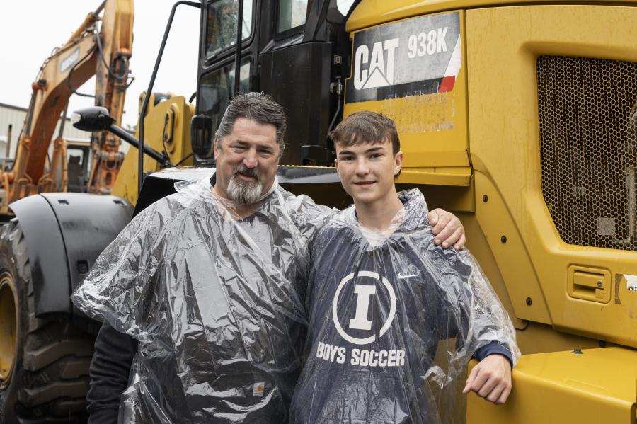 Kevin (L) and Mason McSwiggan of Rockwell Construction of Newton, Conn., check out a 2015 Caterpillar 938K rubber-tire wheel loader.
(CEG photo)