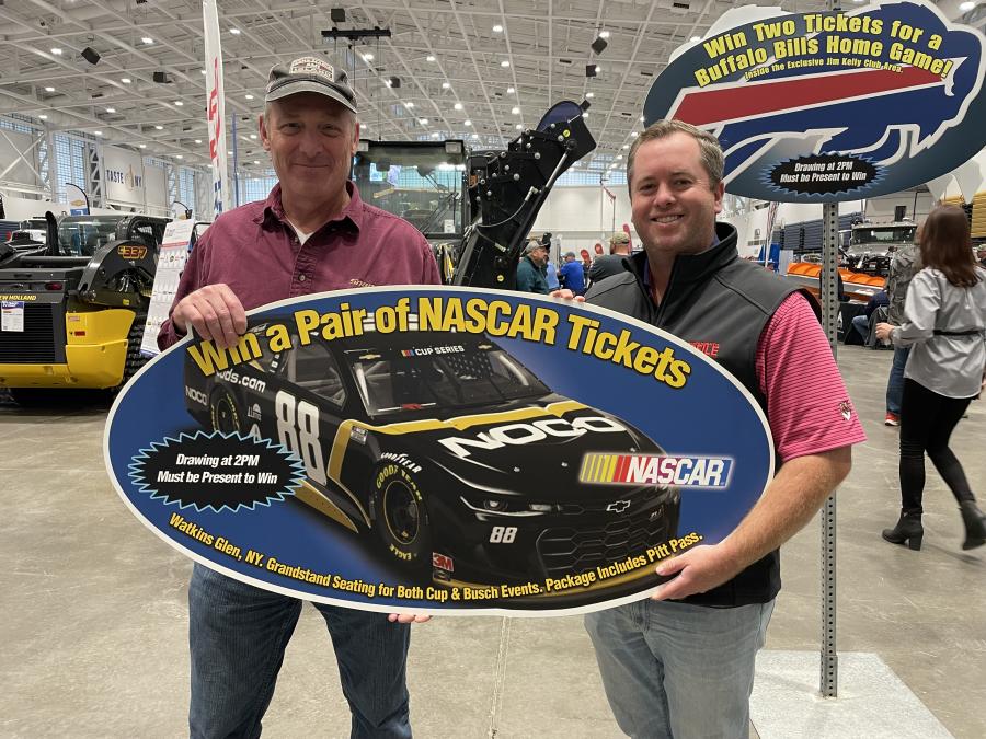 Teddy McKeon (R), show manager of the N.Y.S. Highway & Public Works Expo, presents Grand Prize winner Scott Canfield, highway superintendent of the town of Antwerp, tickets to the 2024 Watkins Glen NASCAR race.(CEG photo)