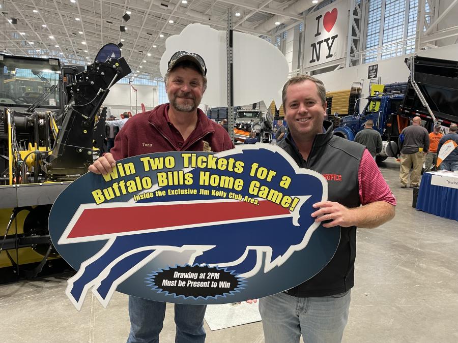 Teddy McKeon (R), show manager of the N.Y.S. Highway & Public Works Expo, presents Grand Prize winner Anthony Domenicone, highway superintendent of the town of Lincoln, tickets to the Buffalo Bills vs. New England Patriots game.
(CEG photo)