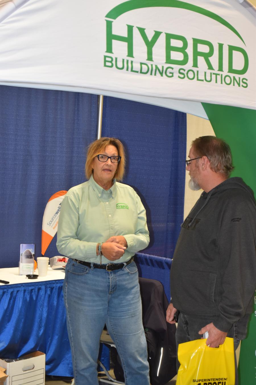 Mary Louise Merkwa of Hybrid Building Solutions speaks with an Expo attendee. Hybrid Building Solutions is well known across the state for its salt and machine storage structures.
(CEG photo)