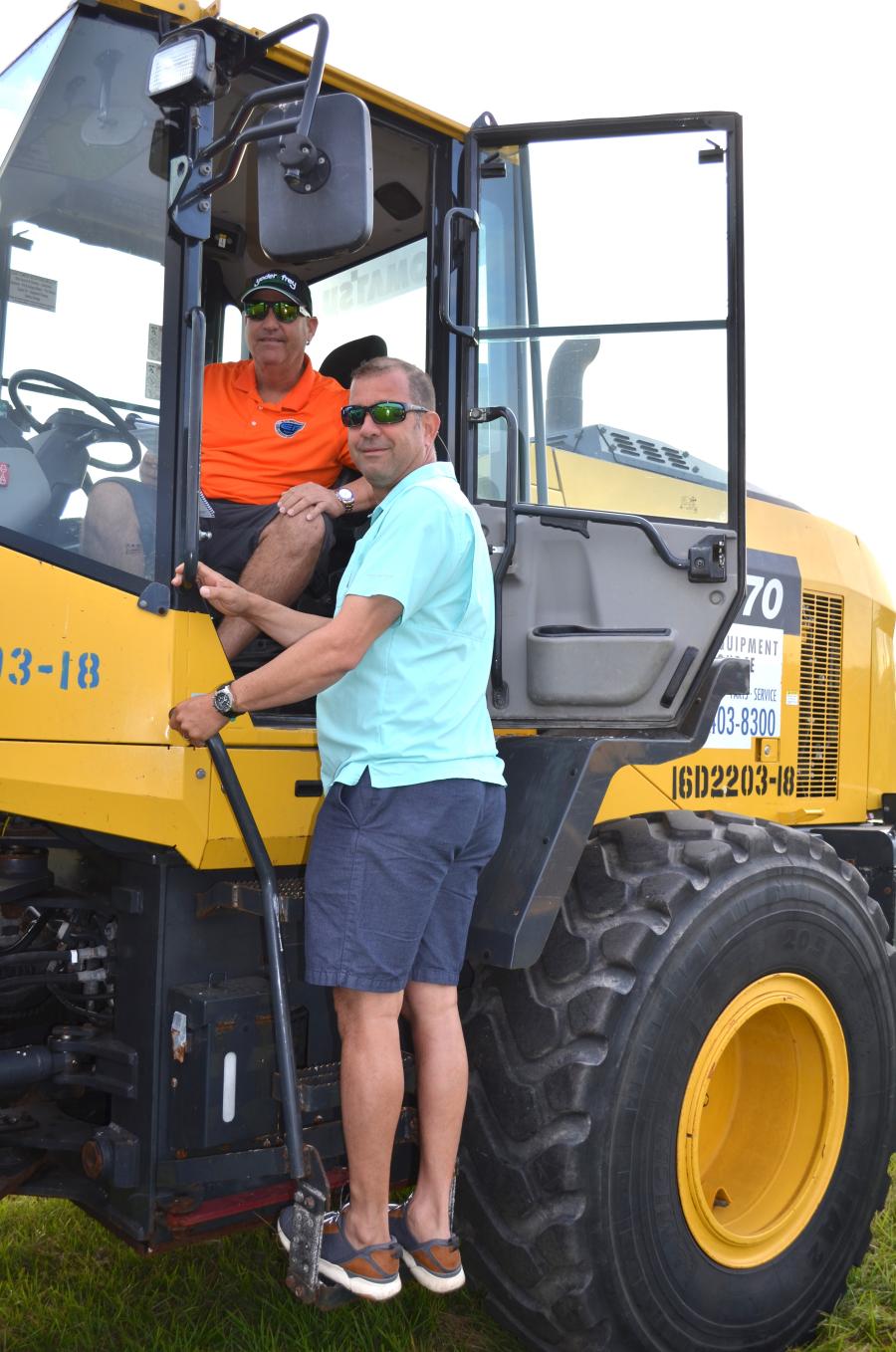 Talking about a Komatsu WA270 of interest are Julian Eloy (in cab) and Yurjen Bereg of Eloy Brothers Inc., contractors based in Naples, Fla.
(CEG photo)