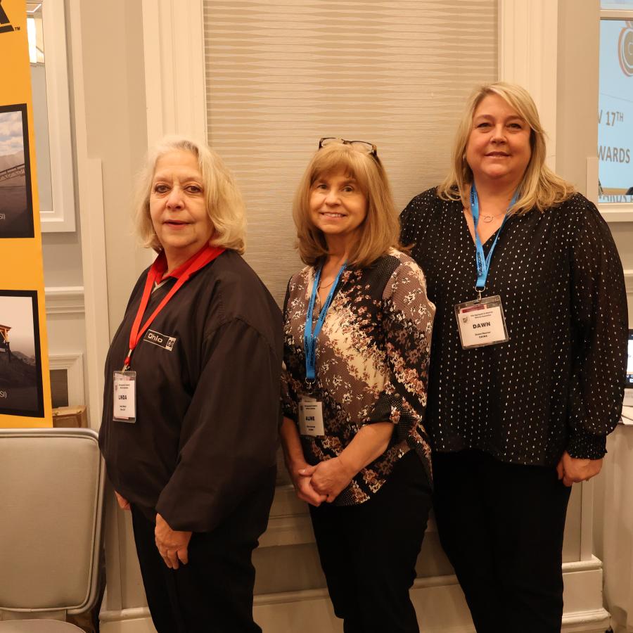 (L-R): Linda Meier of Ohio CAT with OAIMA’s Aline George and Dawn Hoover welcomed attendees to the awards brunch.
(CEG photo)
