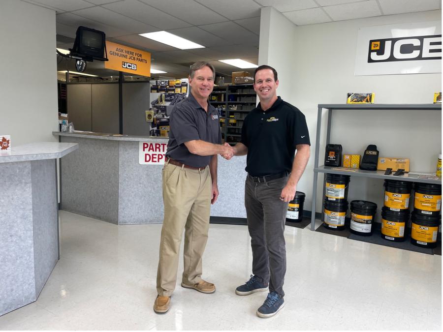 Doug Taylor (R), president and CEO of Earthborne, Inc., and John Bauer, previous owner of Chesapeake Supply and Equipment, sealing the deal with a handshake in the Felton, Del., branch — now Earthborne’s second location.