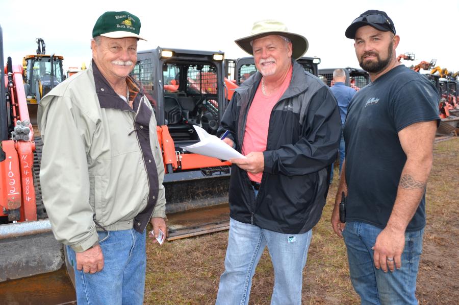 Checking out the Kubota compact track loaders about to be sold (L-R) are Elmer Lingenfelter of Elmer Links Earthworks, Crestview, Fla.; and Thomas Watkins and Mike Bair of Watree Construction and Land Developing, Ft. Walton Beach, Fla.  
 (CEG photo)