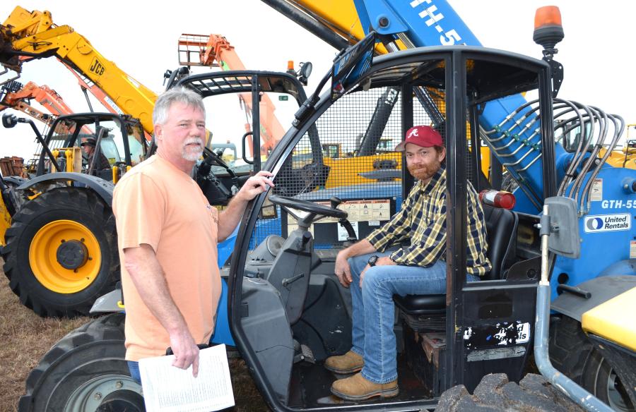 Test operating several material handlers for their resale inventory are Todd Ellis (L) and Jason Berry of Northside Equipment Sales, Arab, Ala.      
 (CEG photo)