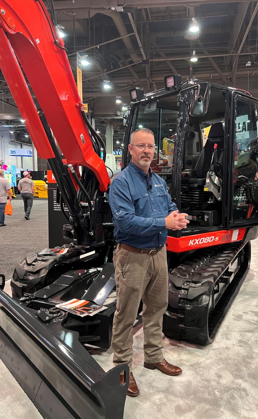 Bill Holton, Kubota product manager for construction equipment, reviews features of the KX080 mini-excavator during a press conference at World of Concrete. (CEG photo)