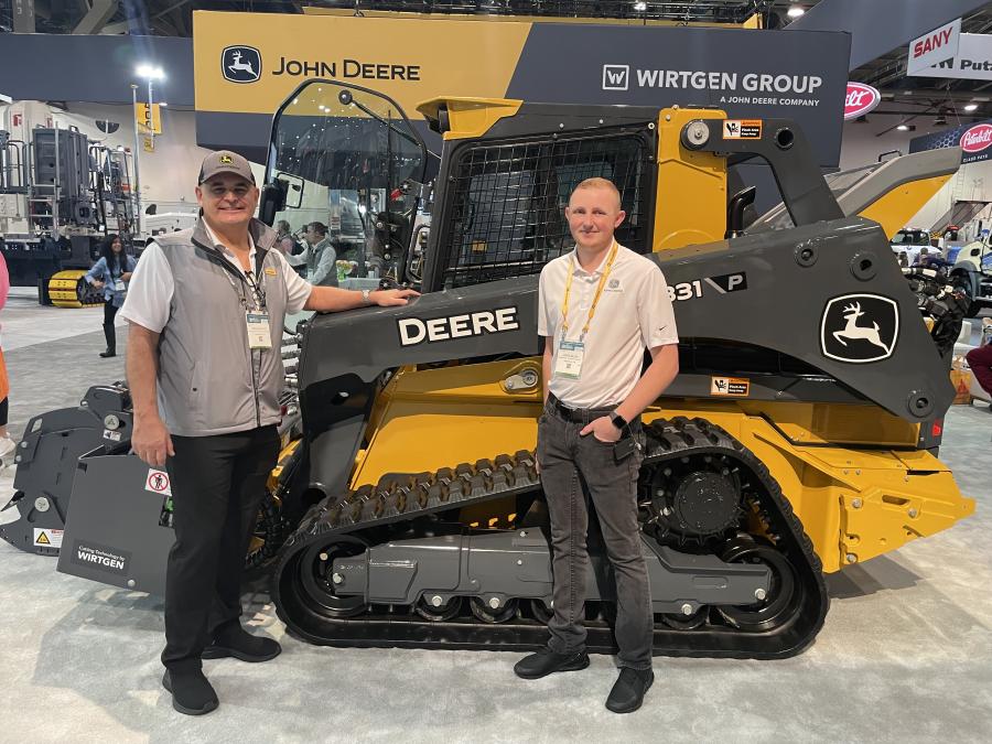 Oran Searles (L) and Jayce Zilles, both of John Deere, were ready to discuss their company’s lineup of equipment at World of Concrete 2024.
 (CEG photo)