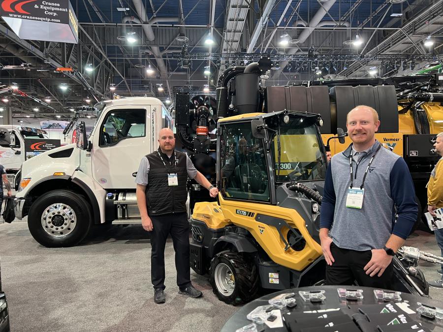 Vermeer Corporation displayed a wide range of equipment at the show, from the ATX720 compact articulated loader to the VXT300 vacuum excavator (background). Seen here with the loader are Vermeer’s Jake Jeffords (L) and Zach Crabtree. (CEG photo)