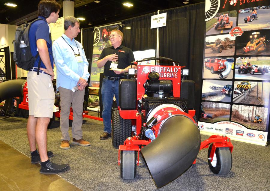 Demonstrating a ride-on debris blower is Buffalo Turbine’s Chris Pukay (R) with prospects Matthew Manners (L) and Richard Manners of Garden State Sealing Inc., Neptune, N.J. (CEG photo)