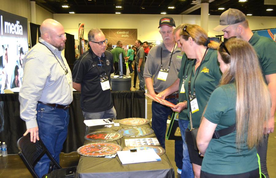 Jesse Buzzard (L) and Jeff Johnson (C) of Diamond Blade Warehouse, based in Vernon Hills, Ill., were busy showing their line of diamond tools to interested attendees.  (CEG photo)