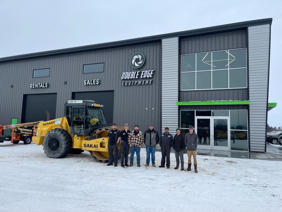Double Edge Equipment staff poses with a SAKAI SV544T in front of their Idaho Falls location.